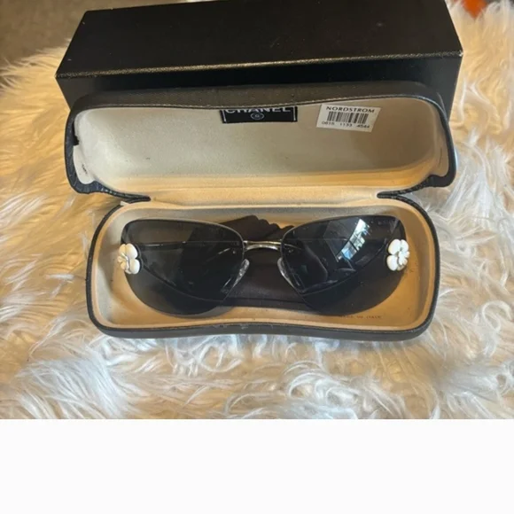 CHANEL Black Sunglasses with White Floral Accents